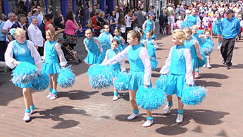 Children of The Southern Starlights Pompom Troupe dancing.