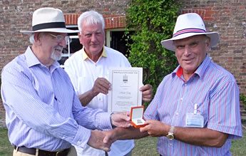 Presentation of a 50 year badge to Mark Tidy